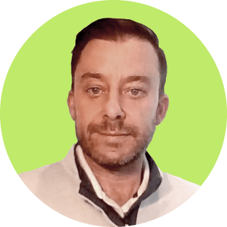 Profile picture of Danny Rainbow, featuring a smiling individual with short hair, inside a green circular frame.